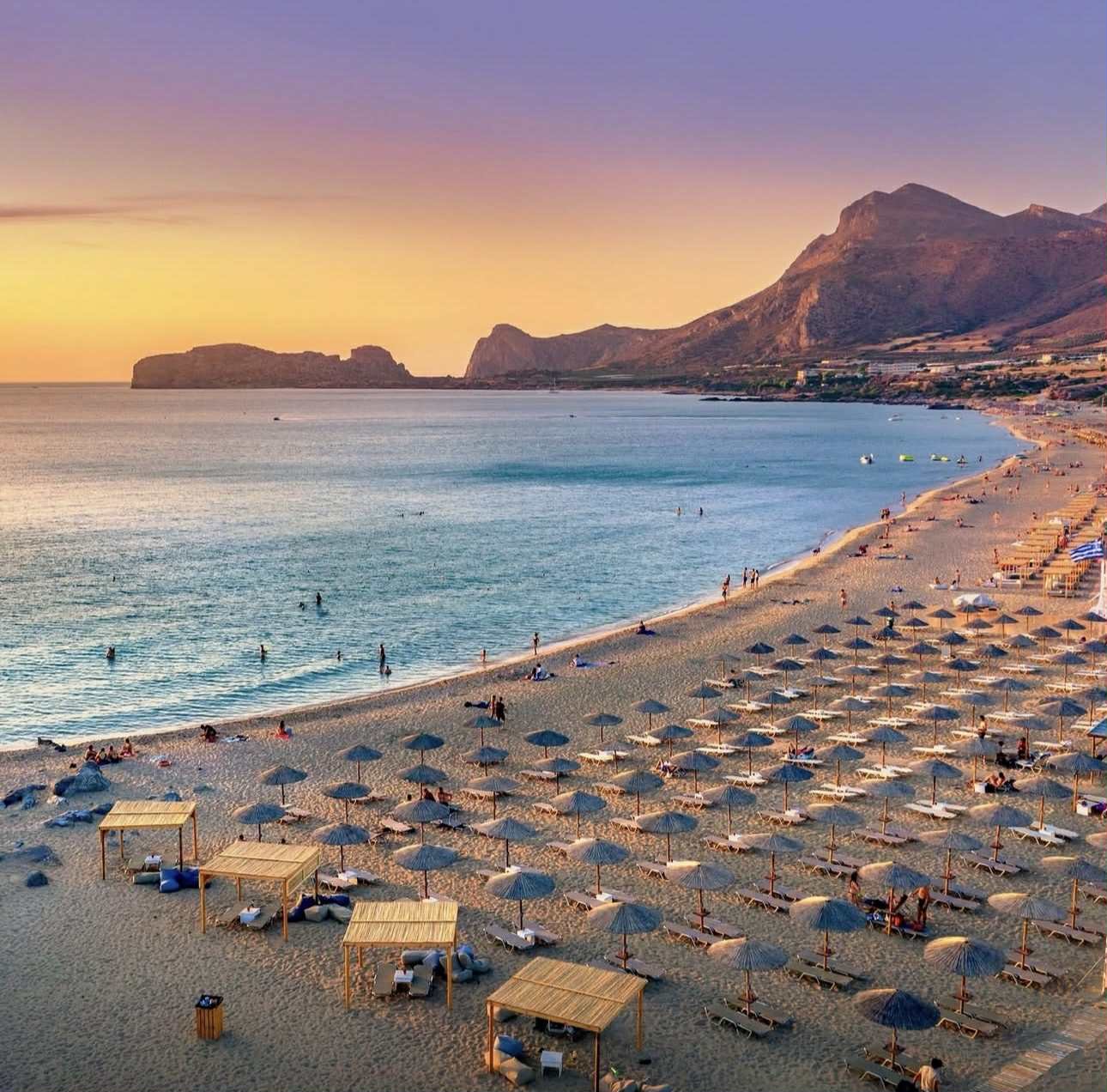 Panorama of turquoise beach Falasarna (Falassarna) in Crete with seagulls flying over, Greece. View of famous paradise sandy deep turquoise beach of Falasarna (Phalasarna), Crete island, Greece.
